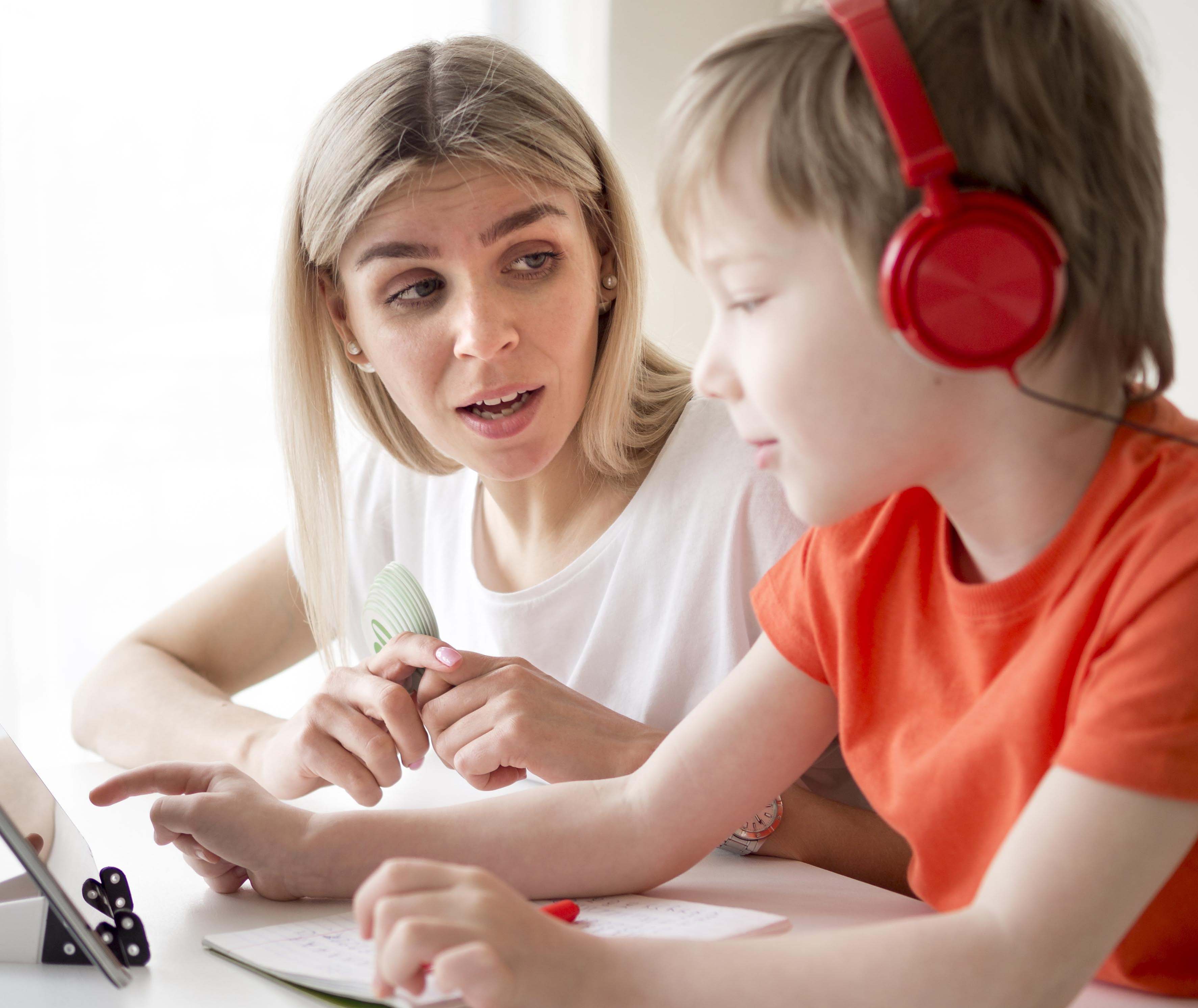 boy-wearing-headphones-writes-his-mother