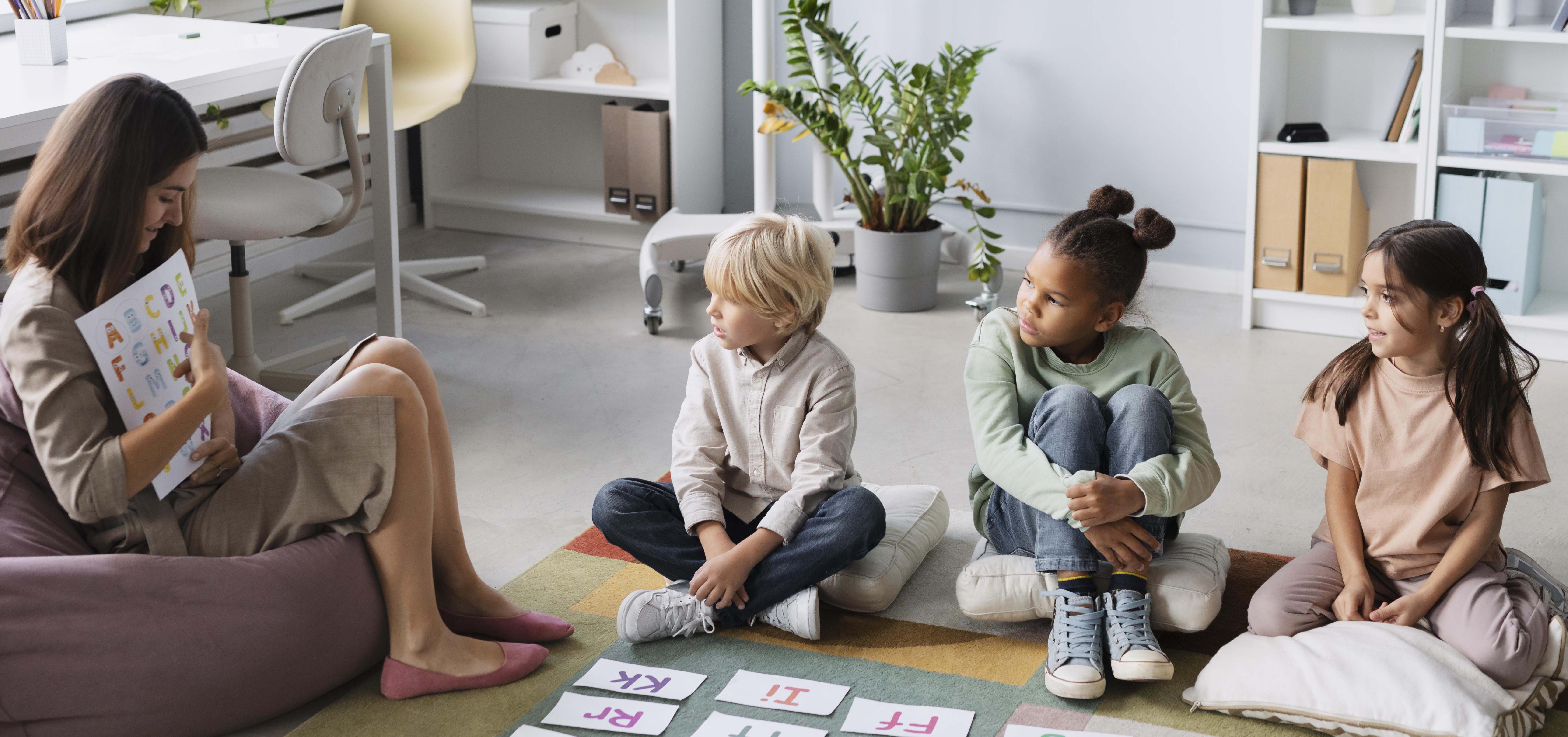 young-woman-doing-speech-therapy-with-kids young-woman-doing-speech-therapy-with-kids